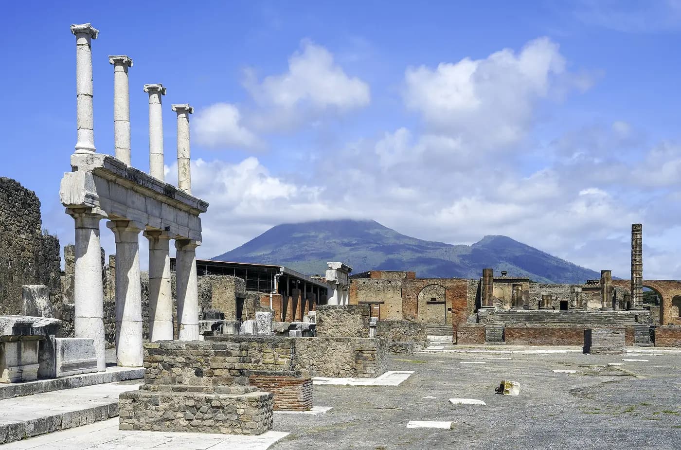 The ruined forum of Pompeii with Mount Vesuvius behind