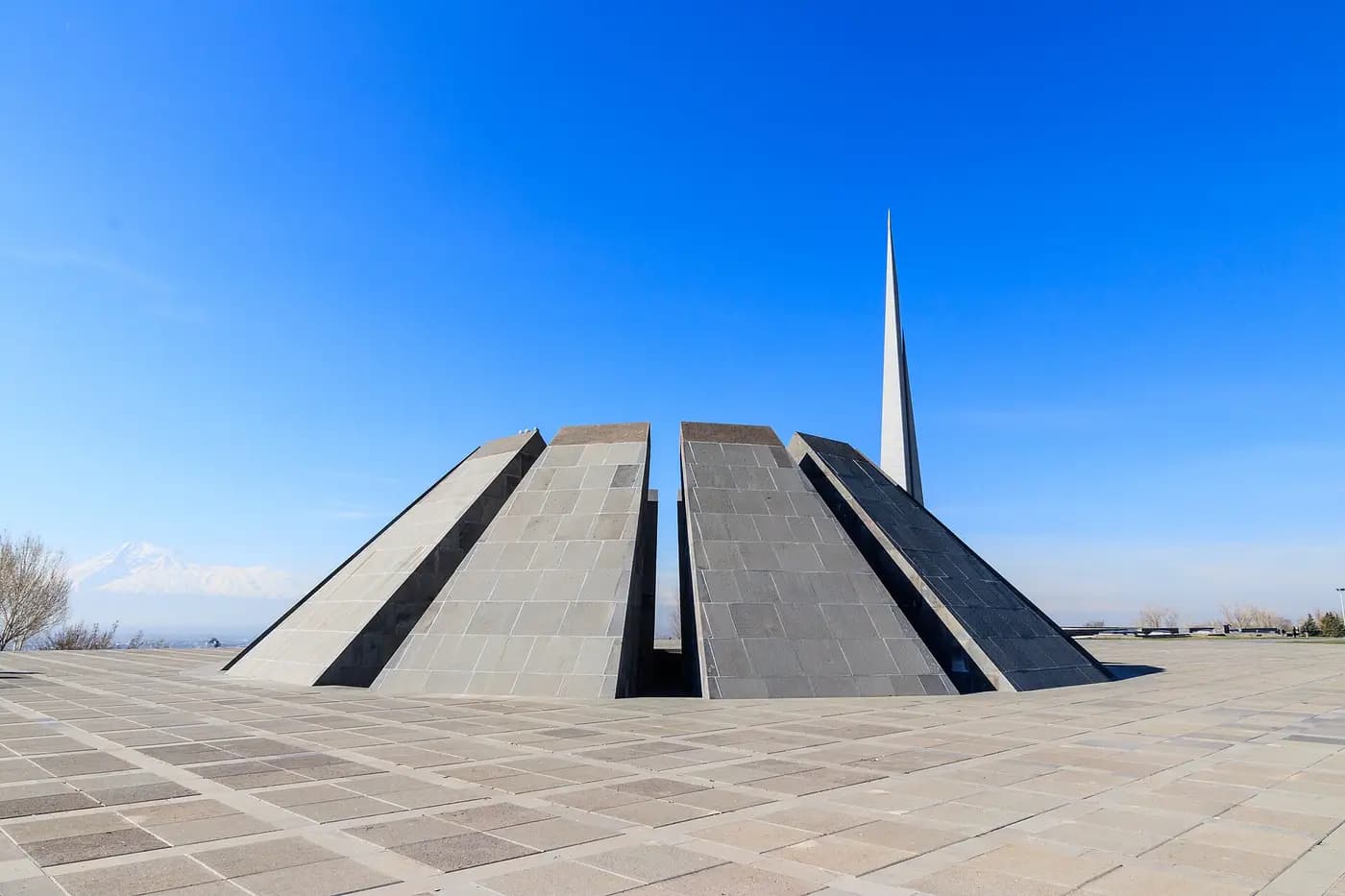The Armenian Genocide Memorial at Tsitsernakaberd hill in Yerevan, with its tall stele and circle of pillars