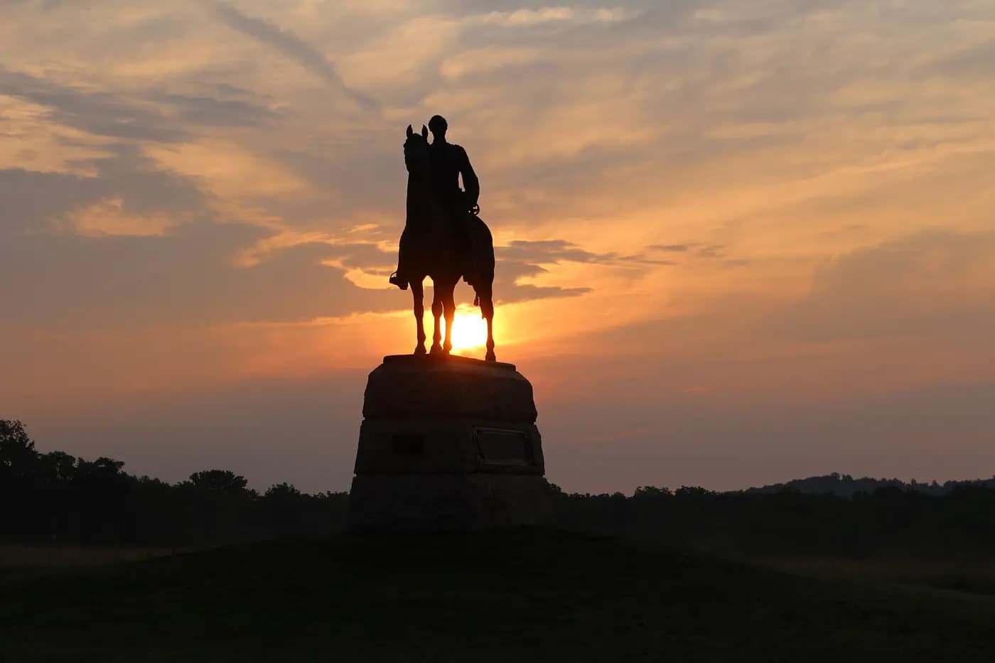 Sunrise behind the statue of General Meade on Cemetery Ridge, Gettysburg battlefield