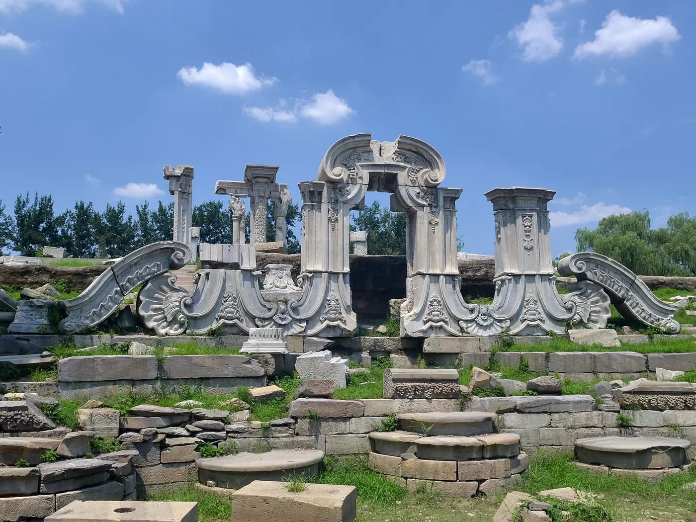 Carved marble ruins of the European-style Dashuifa fountain at the Old Summer Palace