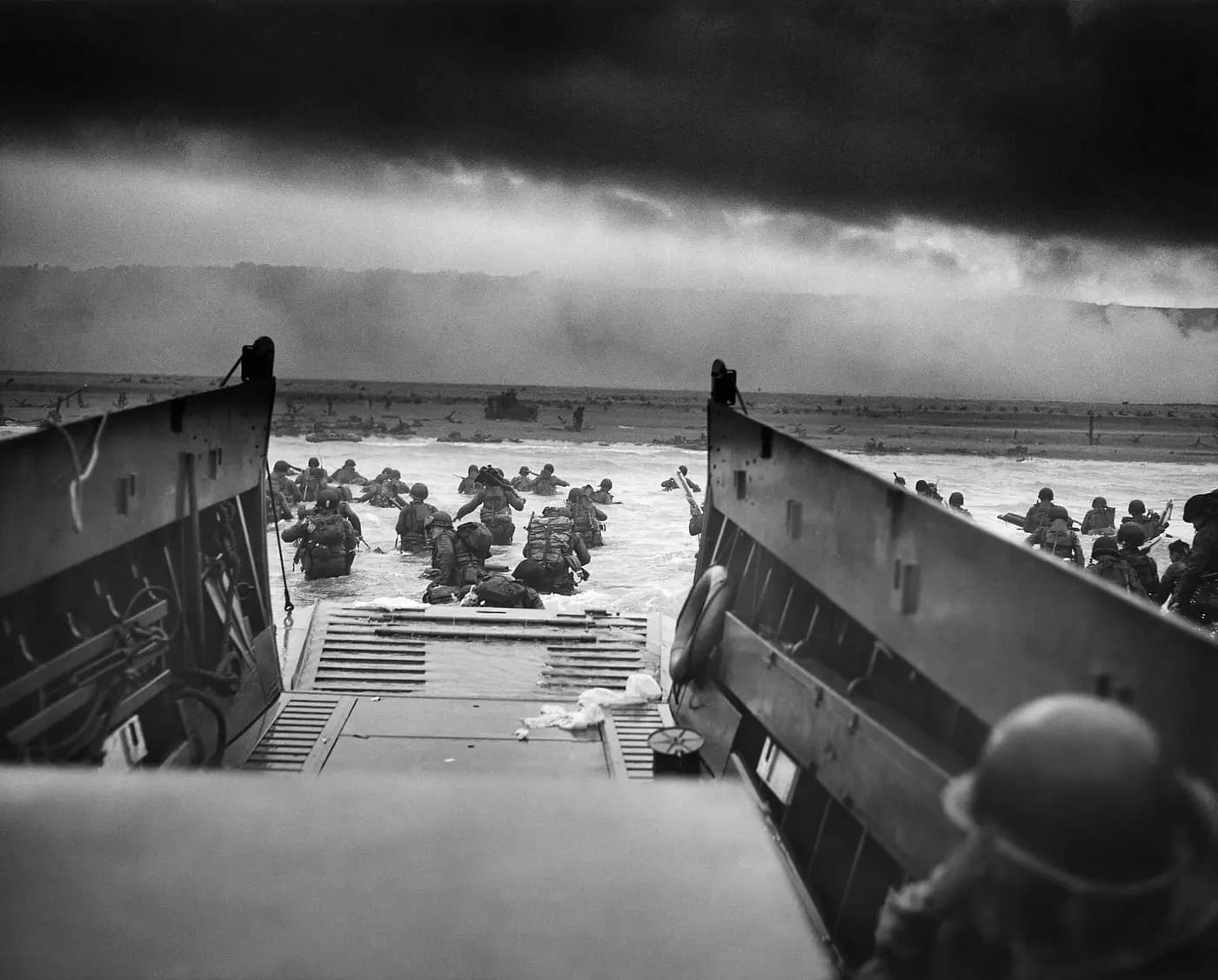 American troops wade from a landing craft towards Omaha Beach on 6 June 1944