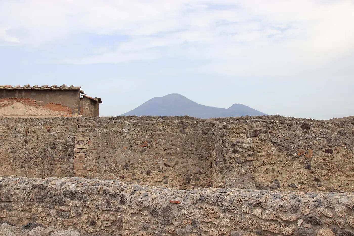 The ruins of Pompeii, with the Temple of Isis in the foreground and Mount Vesuvius behind