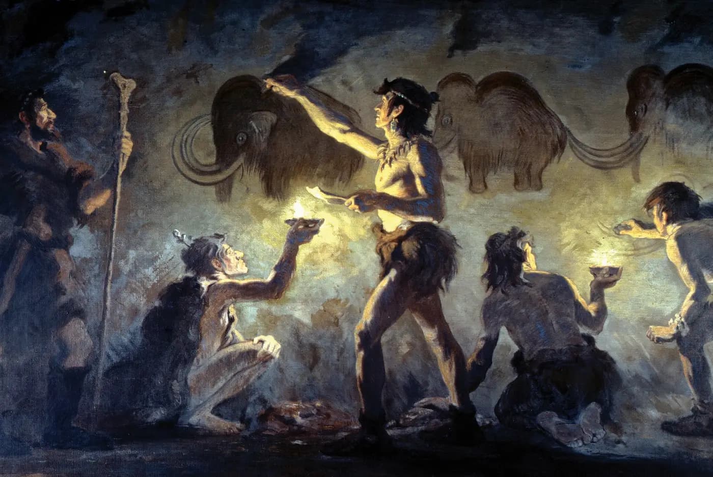 Charles R. Knight painting of Cro-Magnon artists decorating a cave wall with mammoths