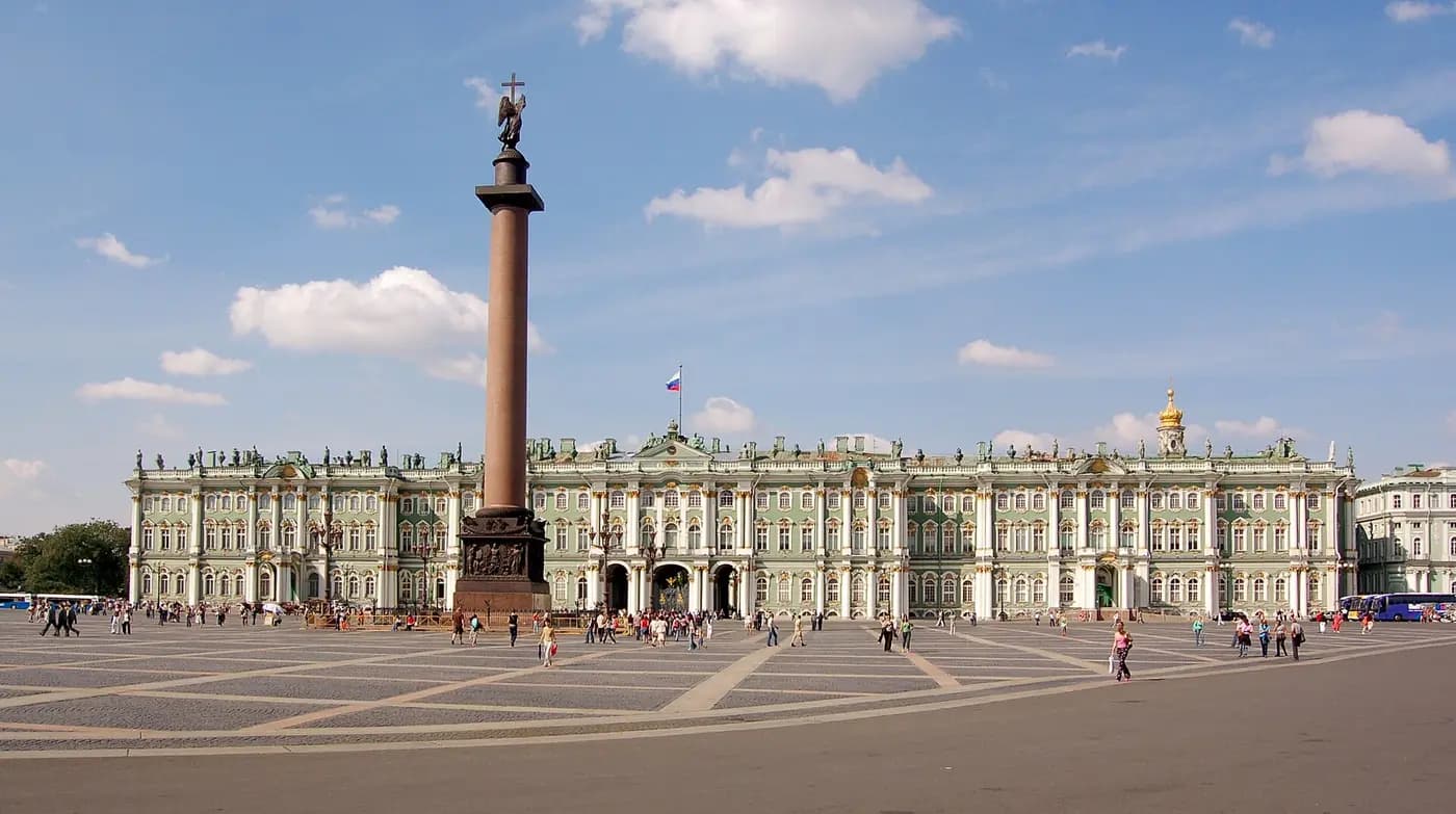 The green and white Winter Palace facade seen across Palace Square, St Petersburg
