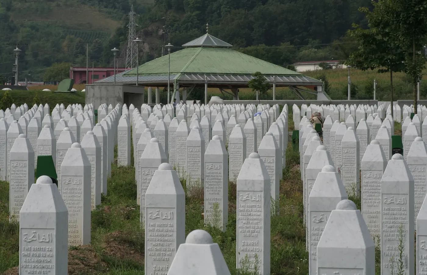Rows of white gravestones at the Srebrenica-Potočari Memorial Cemetery
