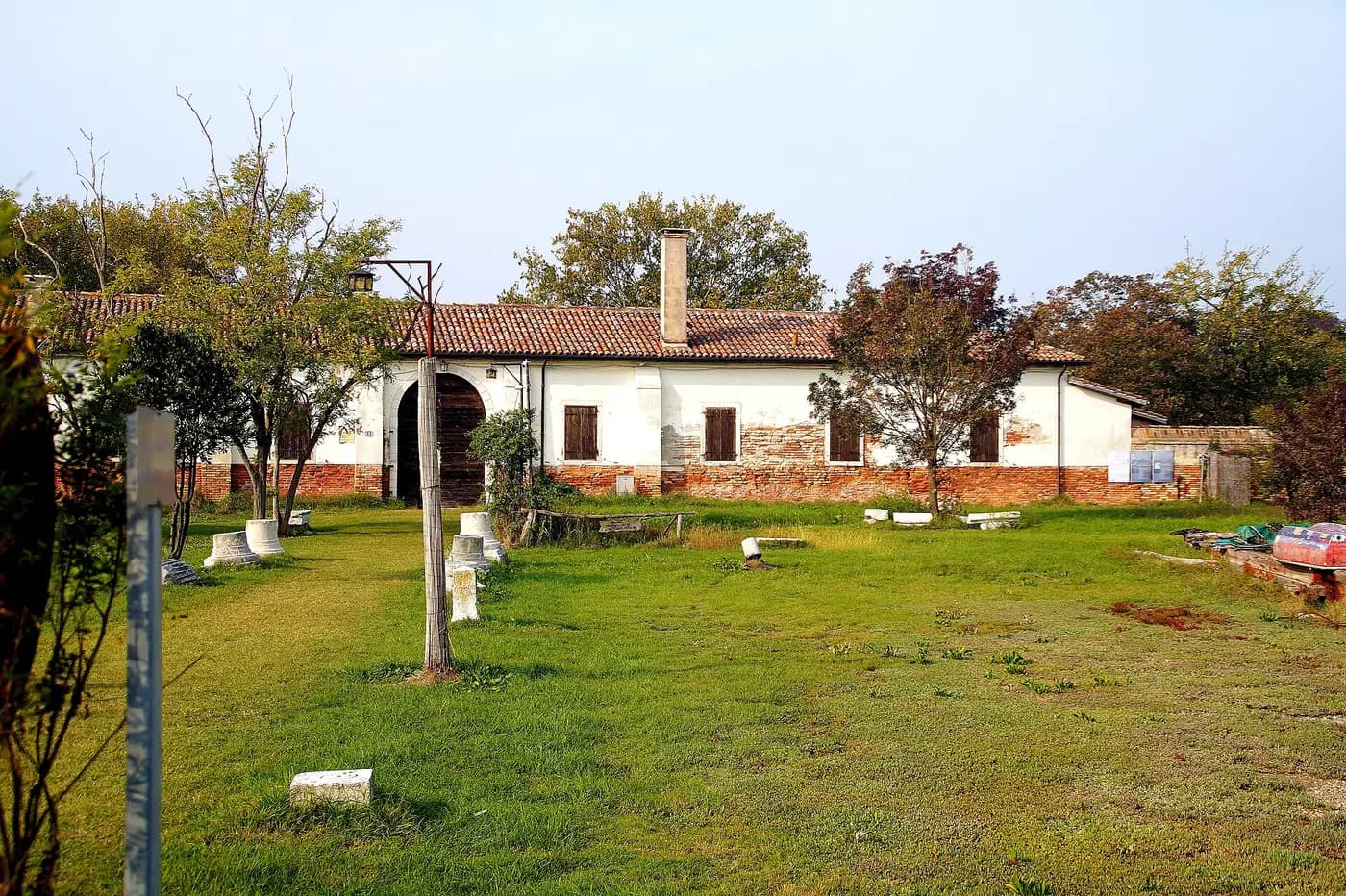 The entrance building and lawn of the Lazzaretto Nuovo quarantine island in the Venetian lagoon